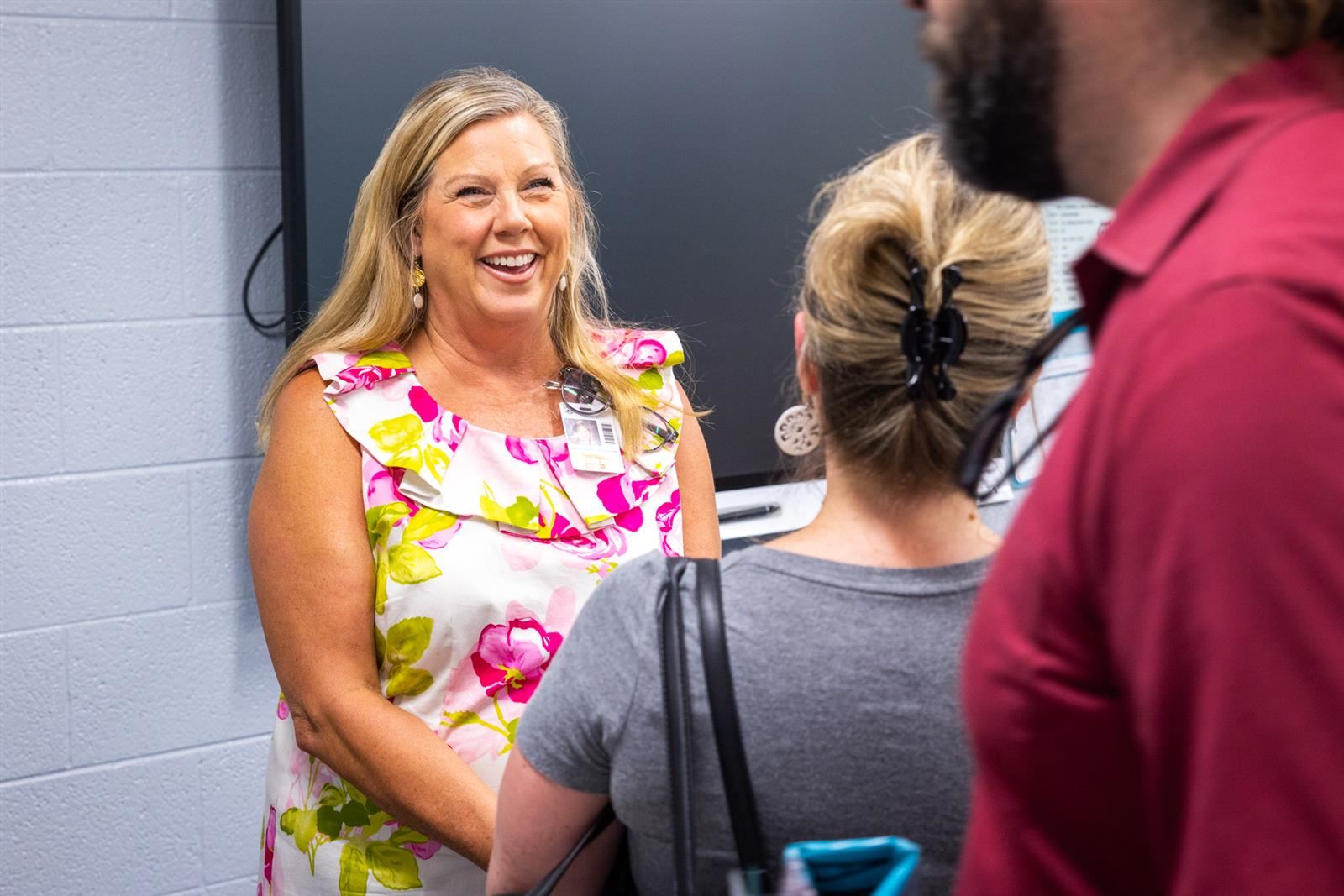 Teacher smiling at Parents